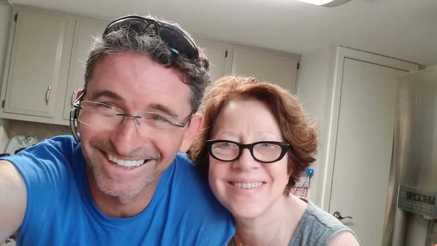 A happy customer with her Moving Pro Inc mover on move day