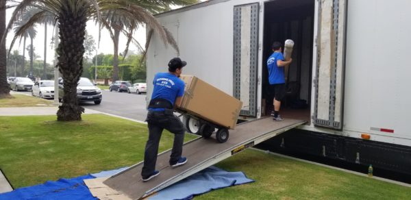 Professional movers handling furniture