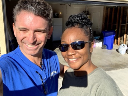 Happy Moving Pro Inc customer with her mover after the move